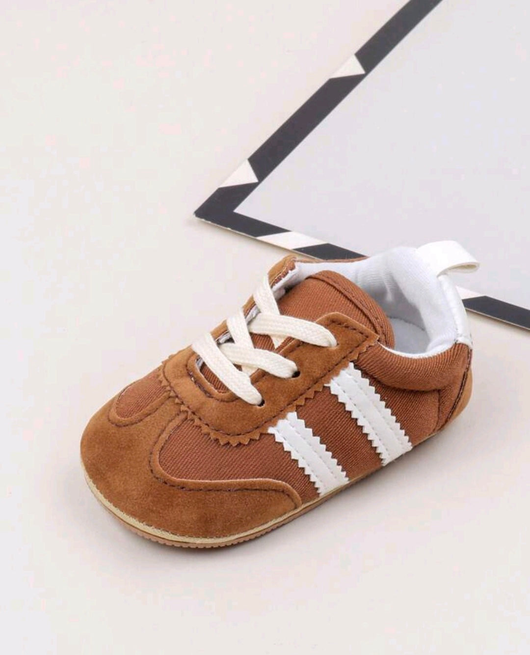 Brown Sneakers with White Stripes