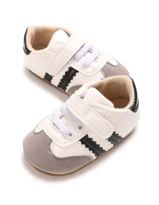 White Sneakers with Black Stripes