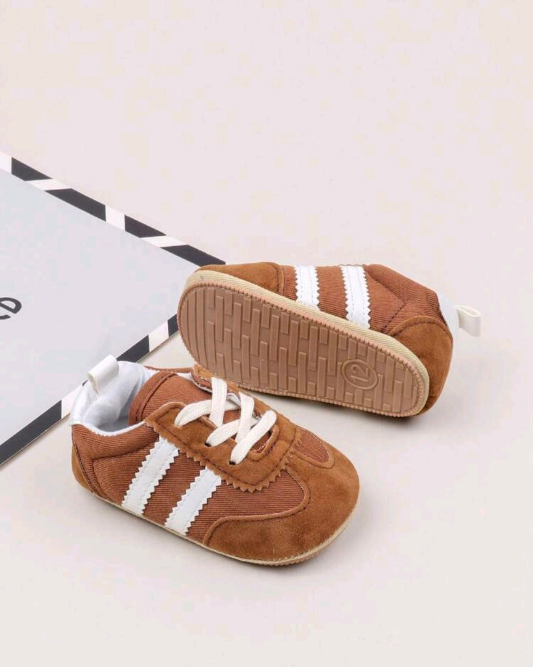 Brown Sneakers with White Stripes