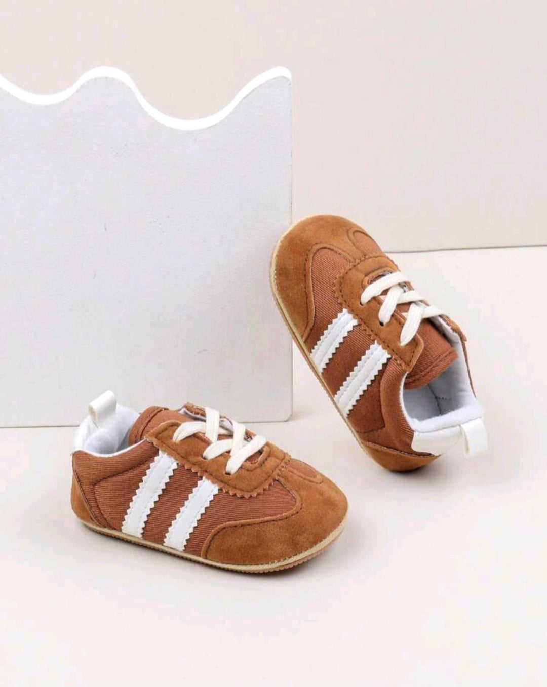Brown Sneakers with White Stripes